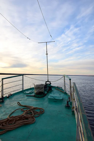 Beautiful view of the Yenisei river from the deck of a river boat with blue sky and clouds