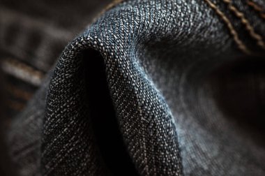 Kot pantolon arka planını ve kumaşı kapat. Kot giyim etiketi etiketi, kilitler.