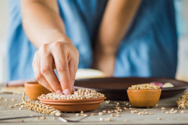 girl holds a grain in her hands.Good harvest