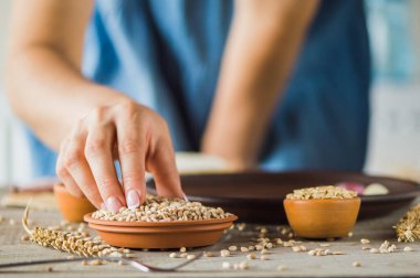 girl holds a grain in her hands.Good harvest