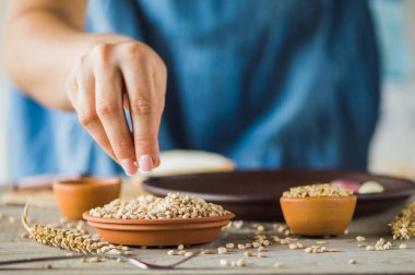 girl holds a grain in her hands.Good harvest