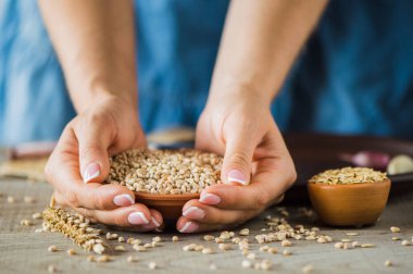 girl holds a grain in her hands.Good harvest