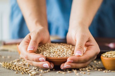 girl holds a grain in her hands.Good harvest