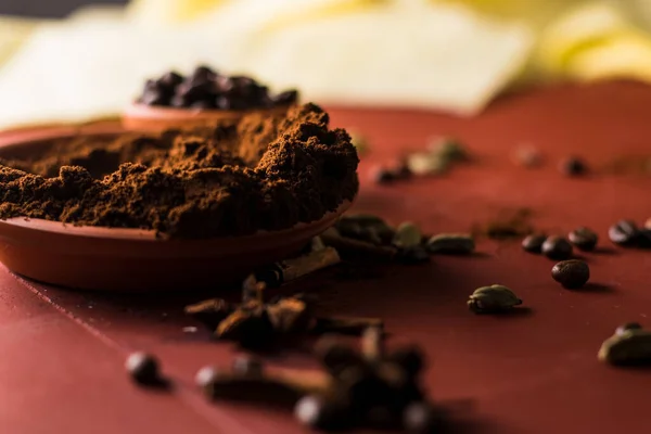 coffee beans on the table and cinnamon.Ground coffee on the table.