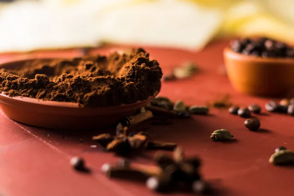 coffee beans on the table and cinnamon.Ground coffee on the table.