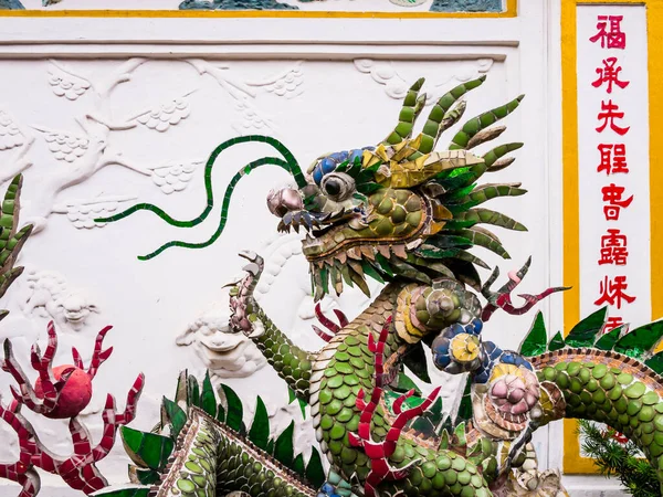 Detail of chinese dragon in the backyard fountain of Phuc Kien Assembly Hall, Hoi An, Vietnam