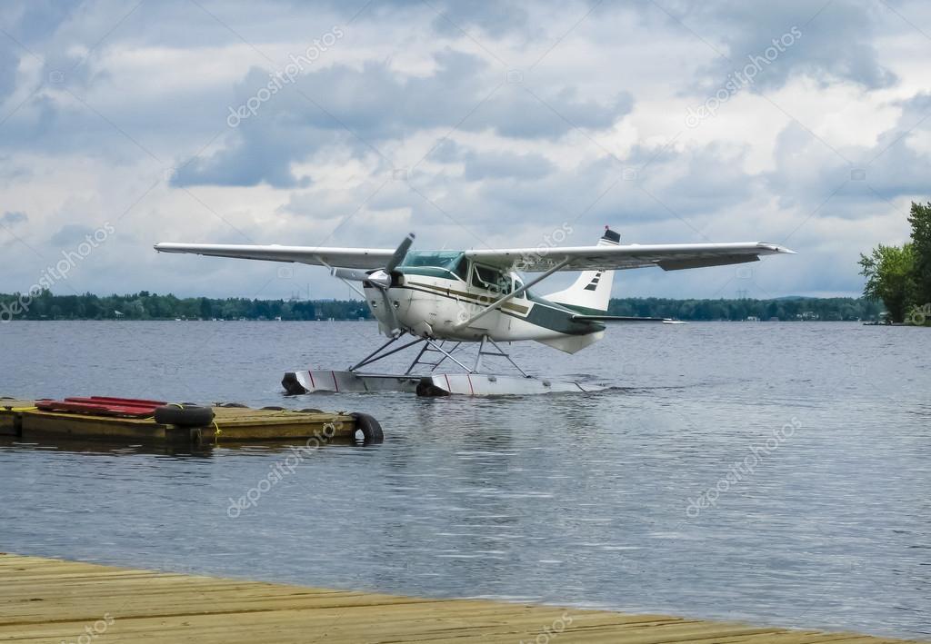 Float plane landing on a lake, Canada — Stock Photo © Photosimo 68030549