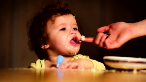 Mom feeds the baby with finger — Stock Video