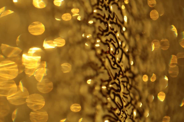 Brillante hermosa refracción de vidrio de oro —  Fotos de Stock