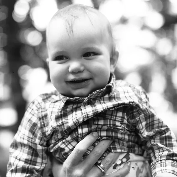 Little boy in mother's hands — Stock Photo, Image