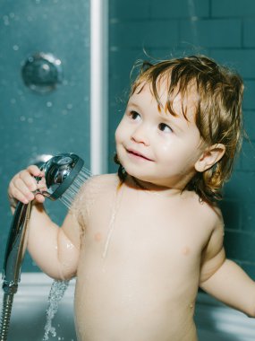 Small baby boy in shower clipart