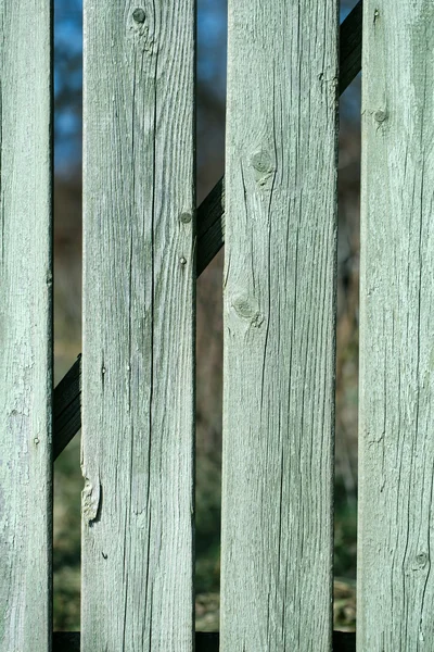 Old blue distant boarded fence — Stock Photo, Image