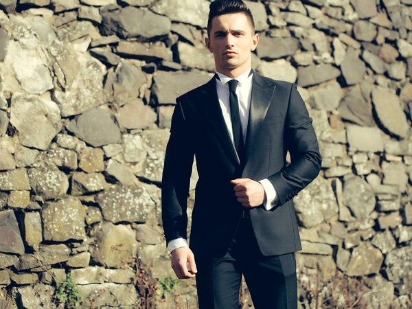 Young man looks in camera