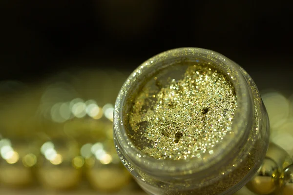Gold makeup glitter — Stock Photo, Image