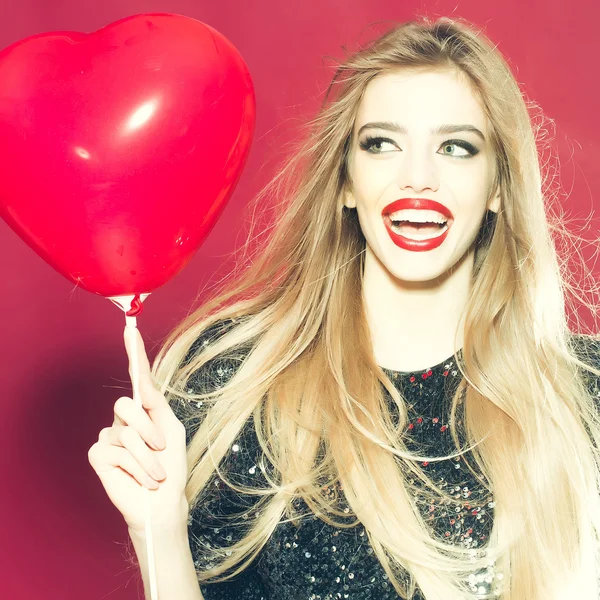 Emotional woman with heart balloon — Stock Photo, Image