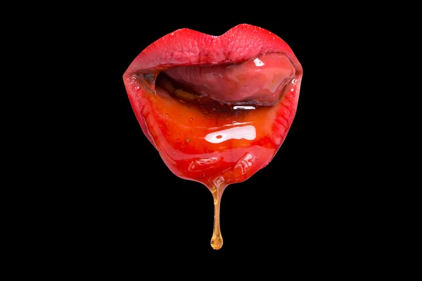 Lábios vermelhos com mel — Fotografia de Stock