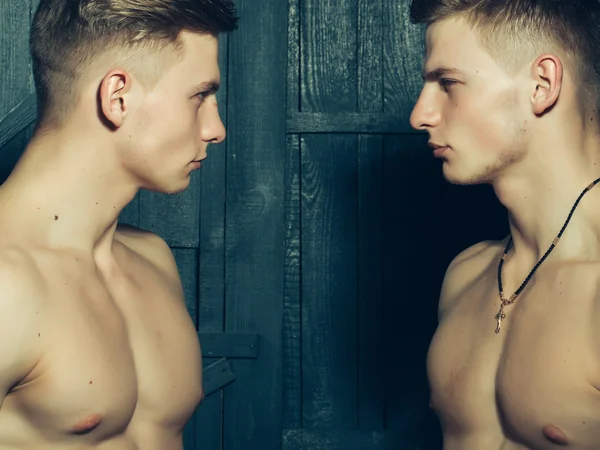 Twins with muscular chest — Stock Photo, Image