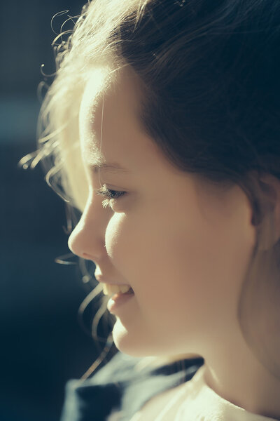 Beautiful young girl closeup with smiling face sunny day outdoor