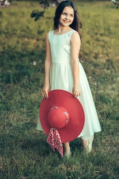 Retro girl on green grass — Stock Photo, Image