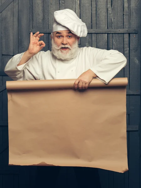 Koch Mann mit leerem Papier — Stockfoto