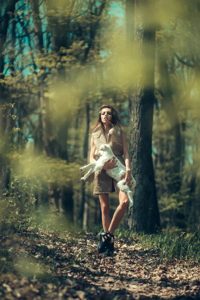 Young girl with goat in forest — Stock Photo, Image