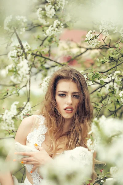 Woman with goat in blossom — Stock Photo, Image