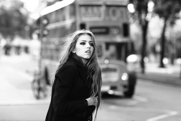 Stylish girl in street near bus — Stock Photo, Image