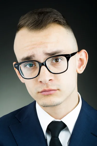 Emotional young guy in glasses — Stock Photo, Image