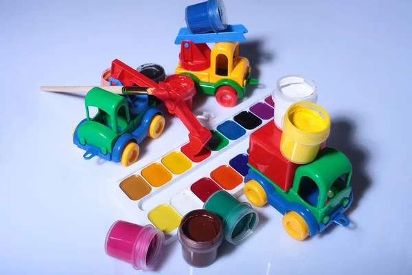 Watercolor palette with toy car — Stock Photo, Image