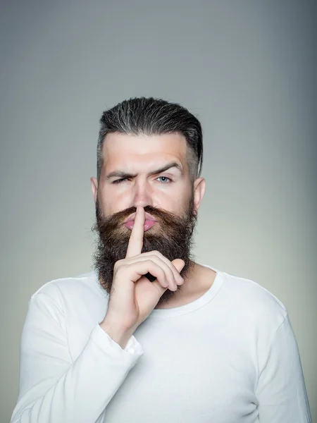 Hush hareketi ile sakallı adam — Stok fotoğraf