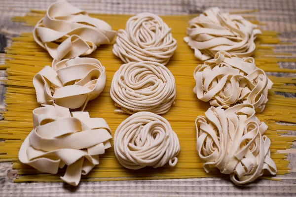 Tagliatelle on spaghetti — Stock Photo, Image