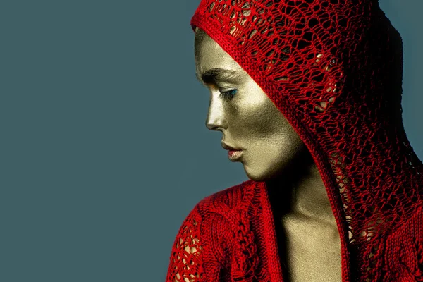 Gold woman in red jacket — Stock Photo, Image