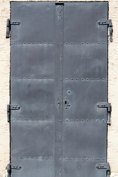 Hard black metal door — Stock Photo, Image