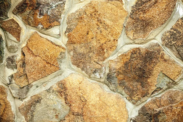 Raue Mauer aus Natursteinen — Stockfoto
