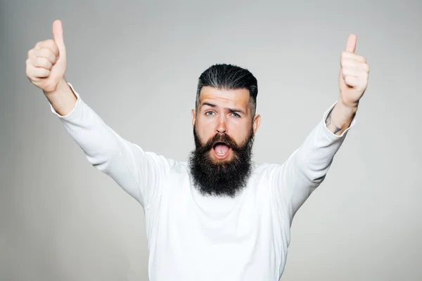 Bearded man with super gesture — Stock Photo, Image