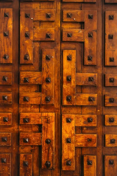 Door of orange old barn boards — Stock Photo, Image