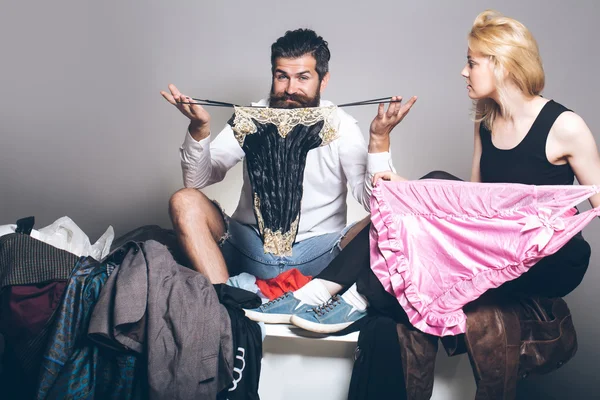 Young couple in bath with clothes — Stock Photo, Image