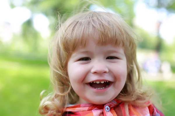 Happy small boy on green natural background — Stock Photo, Image