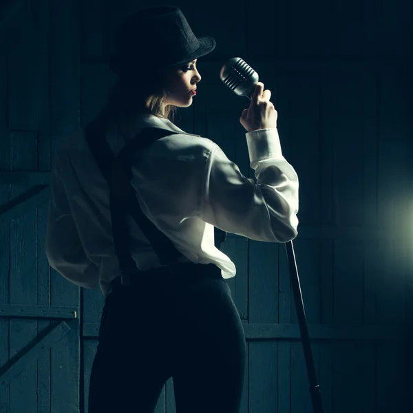 Retro woman with microphone — Stock Photo, Image