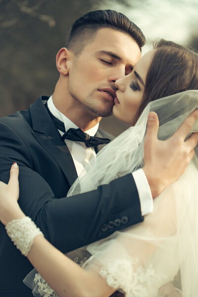 Kissing wedding couple