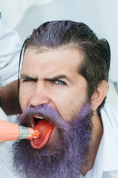 Young man with lilac beard — Stockfoto