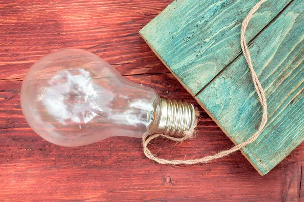 Incandescent light bulb with rope — Stock Photo, Image