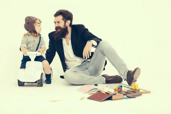 Small boy driver or pilot and bearded father — Stock Photo, Image