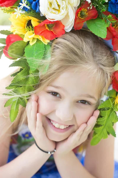 Small girl in embriodered dress and flower national wreath — Stock Photo, Image