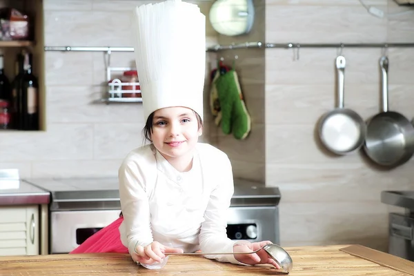 Little girl with ladle — Stock Photo, Image