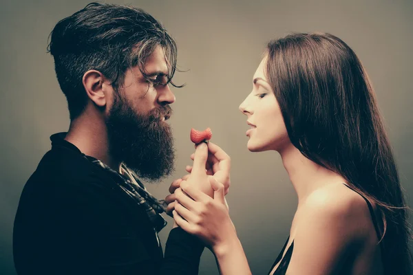 Sexy couple eating red strawberry — Stock Photo, Image