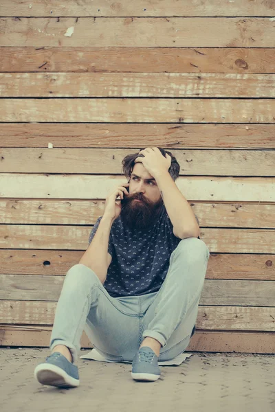 Handsome bearded man om the phone