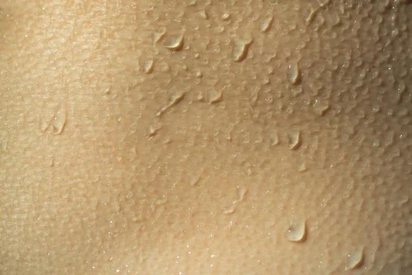 Мокрый фон кожи человека — стоковое фото