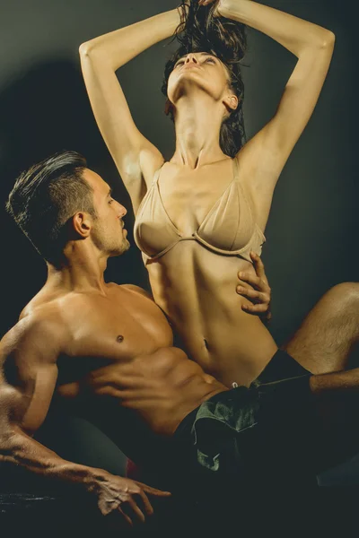 Sexy young couple in studio — Stock Photo, Image