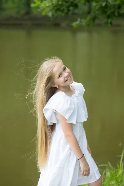 Small girl in white dress outdoor — Stock Photo, Image